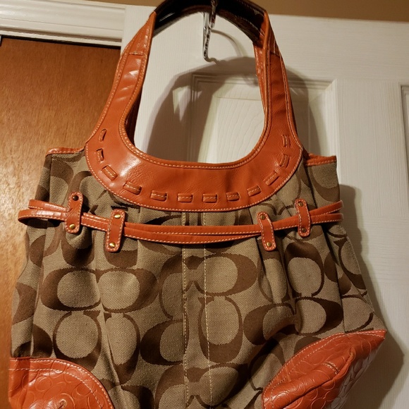 Color is Orange and Brown Coach Hand Bag